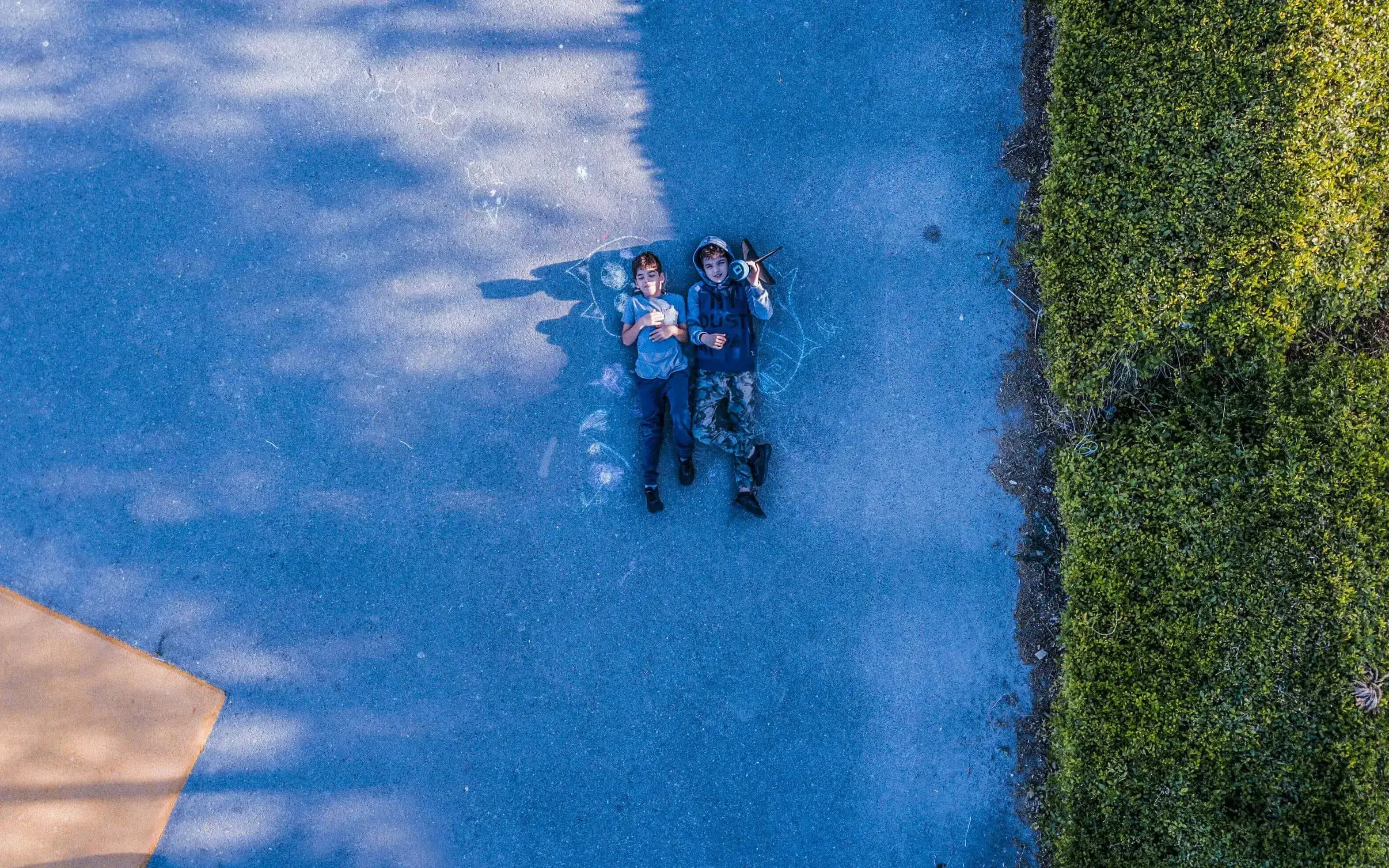 Two adolescents watching the sky. 