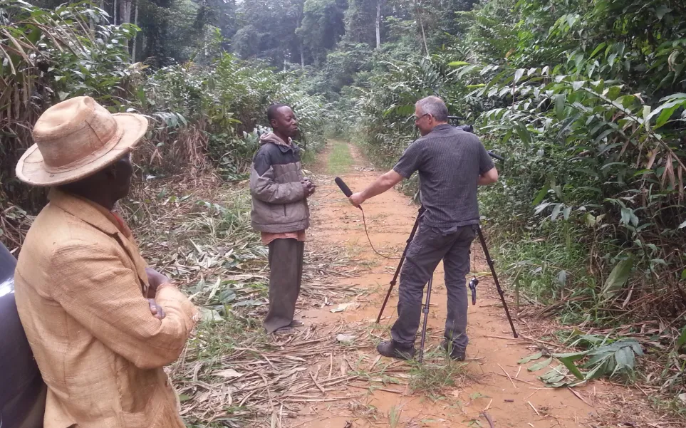 Michel Peremans interviewing a forester for the film "A change for change" in the Congo / Photograph: Fern