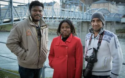 Three members of refugee.tv team: Newton Osaruoname Idemudia (cameraman) Olivia Christopher (presenter) and Fathi Ghanim (cameraman) / Photograph: refugee.tv