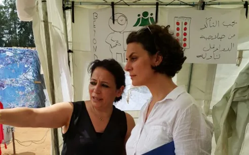 Maria Khayat Assi, CEO of BEYOND Association, with a WHO officer in a field visit / Photograph: BEYOND Association 
