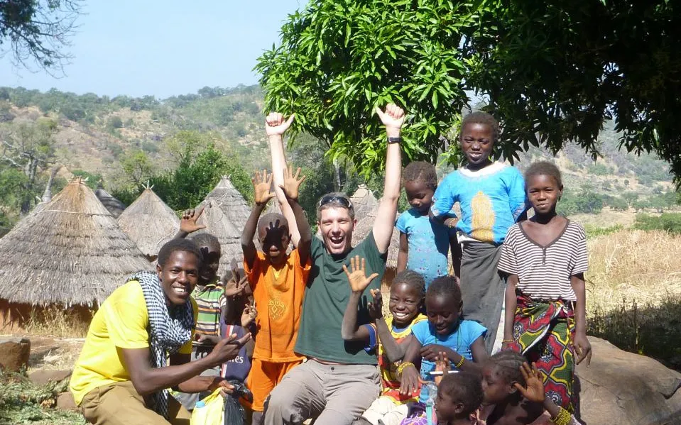 Sidi and children having a good time in Kédougou. Photo: YAA