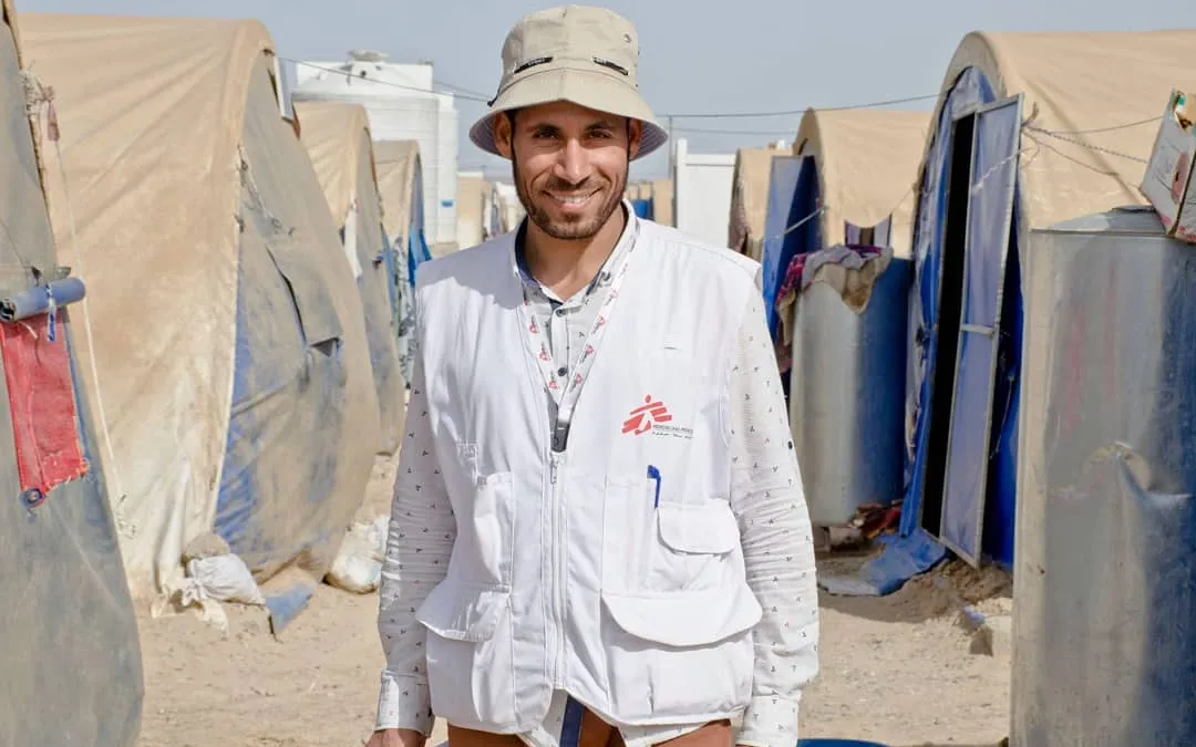 Ali is a proud health worker at a refugee camp. Doctors without borders. 