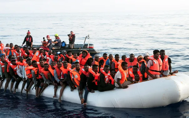 Dozens of Sub-Saharan migrants in a small dinghy