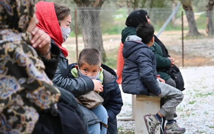 A family in the refugee camp several days before the fire.
