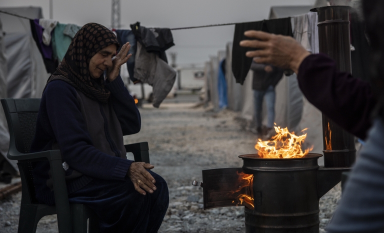 Syrian refugees light wood fires by night and burn plastic to stay warm. Many received medical services from DDD/MDM in a camp in Hatay on Friday, March 3, 2023.
