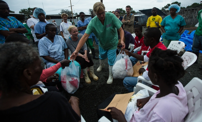 Doctors Without Borders staff distribute take-home kits for Ebola survivors. Photo: Morgana Wingard, Flickr